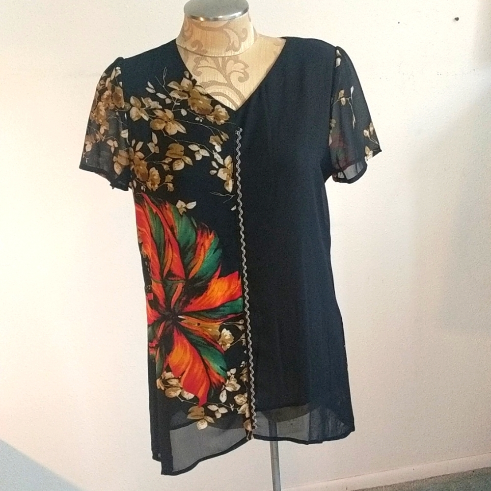 Beautiful Lined blouse with intricate beading down from and back. Never worn